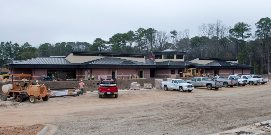 MOODY AIR FORCE BASE, Ga. -- Contractors work at the new Child Development Center construction site Feb. 24. The new CDC, which is scheduled to be completed this summer, will be Leadership in Energy and Environmental Design-certified at the silver level. LEED is a consensus-based standard to support and certify successful green building designs, constructions and operations. It verifies that a building is environmentally responsible and is a healthy place to live and work. (U.S. Air Force photo/Staff Sgt. Jamal D. Sutter)(RELEASED)