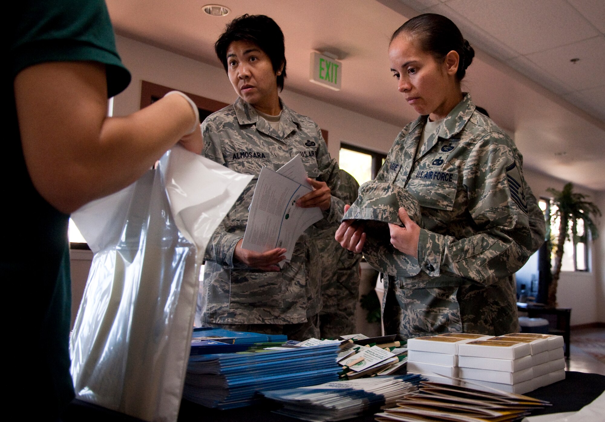 Senior Master Sgt. Merian Almosara, 624th Regional Support Group human resources specialist, and Master Sgt. Josephine Taitague, 624th Regional Support Group chief of education and training, collect information on investing at the 624th Regional Support Group’s 2011 Financial Fair, Feb. 12, at the Makai Recreation Center. The event, in support of Military Saves Week which runs from Feb. 20-27, included classes on retirement, saving and investing and finance for teens. Financial stability is a large factor in deployment readiness and the fair offered resources and information necessary to help with financial readiness. (U.S. Air Force photo/Staff Sgt. Erin Smith)