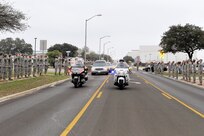 Men and women from Lackland line the street Feb. 24 as a show of respect for Airman 1st Class Corey C. Owens, an Airman from San Antonio who died Feb. 17 during a deployment to Al Asad Air Base, Iraq. Airman Owens was assigned to the 47th Security Forces Squadron, Laughlin Air Force Base, Texas. (U.S. Air Force photo/Tony Morano) 