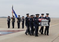 Members of the Lackland Air Force Base Honor Guard transfer the remains of Airman 1st Class Corey C. Owens at Lackland's Kelly Field flightline Feb. 24. Airman Owens died Feb. 17 during a deployment to Al Asad Air Base, Iraq, in support of Operation New Dawn. He was assigned to the 47th Security Forces Squadron, Laughlin Air Force Base, Texas. (U.S. Air Force photo/Tony Morano)  