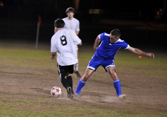VALDOSTA, Ga.-- Joseph Foster, player from Moody’s soccer team, steals the ball from a Valdosta State University Blazers defender during a rematch Feb. 22. The Moody team started the game off with aggressive defense and was determined to gain a victory but fell short with a 4-1 loss.  (U.S. Air Force photo/Airman 1st Class Joshua Green)(RELEASED)
