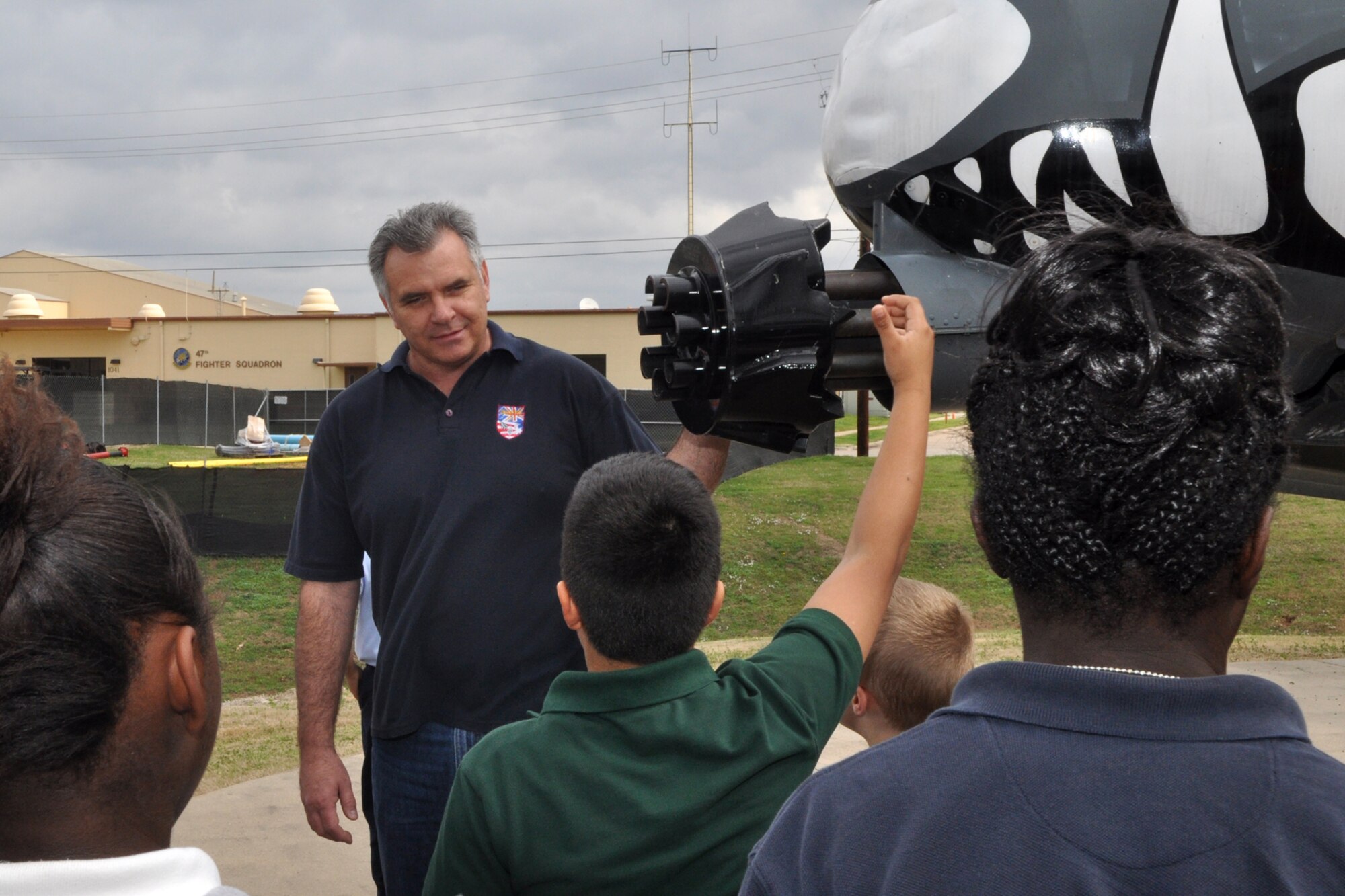 Greg Steele, a photographer for the 307th Bomb Wing’s Public Affairs Office, fields some questions from a group of Bossier Parish 5th Grade students during a briefing about the A-10 Thunderbolt II at Barksdale Air Force Base, La., Feb. 24, 2011. The students are attending STARBASE Louisiana, at Barksdale, one of 60 national STARBASE sites. It is sponsored by the 307th Bomb Wing of the Air Force Reserve Command. This particular briefing consisted of students from two separate classes, one from Bossier Elementary and the other from Waller Elementary. The program presents an exciting 25-hour hands on/minds on aviation and aerospace curriculum to area 5th grade students and their teachers. The DoD program is committed to addressing the critical needs in STEM education - Science, Technology, Engineering and Mathematics - STARBASE Louisiana introduces its students to exciting STEM education topics, inspiring these young minds to further explore these topics in future course work. (U.S. Air Force photo/Tech. Sgt. Jeff Walston)