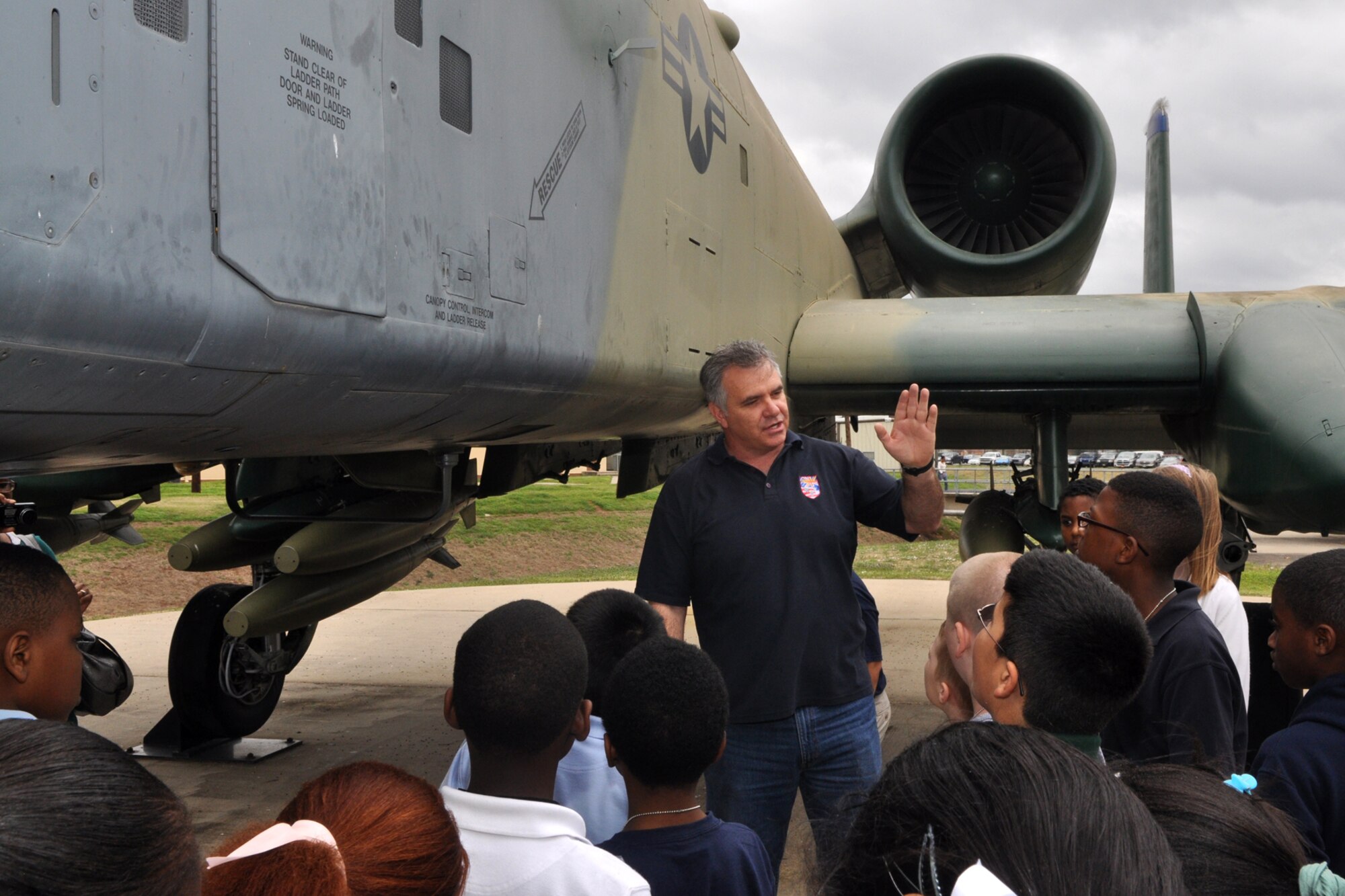 Greg Steele, a photographer for the 307th Bomb Wing’s Public Affairs Office, discusses aircraft attitude, which is how an aircraft climbs and descends, with a group of Bossier Parish 5th Grade students during a briefing about the A-10 Thunderbolt II at Barksdale Air Force Base, La., Feb. 24, 2011. The students are attending STARBASE Louisiana, at Barksdale, one of 60 national STARBASE sites. It is sponsored by the 307th Bomb Wing of the Air Force Reserve Command. This particular briefing consisted of students from two separate classes, one from Bossier Elementary and the other from Waller Elementary. The STARBASE program presents an exciting 25-hour hands on/minds on aviation and aerospace curriculum to area 5th grade students and their teachers. The DoD program is committed to addressing the critical needs in STEM education - Science, Technology, Engineering and Mathematics - STARBASE Louisiana introduces its students to exciting STEM education topics, inspiring these young minds to further explore these topics in future course work. (U.S. Air Force photo/Tech. Sgt. Jeff Walston)