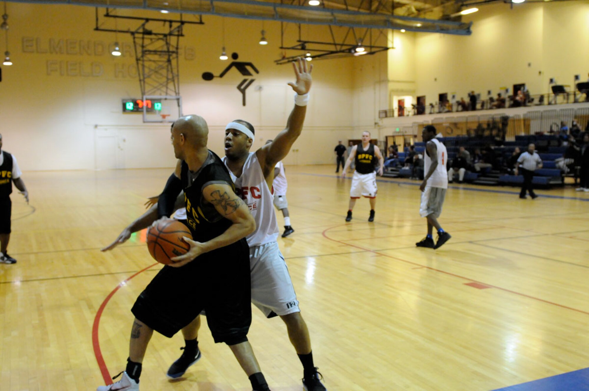 Alaska National Guard, in the white jerseys played agains A Company, 725th Brigade Support Battalion, in the final game of intramural basketball at Joint Base Elmendorf-Richardson. (U.S. Air Force photo/Steve White)