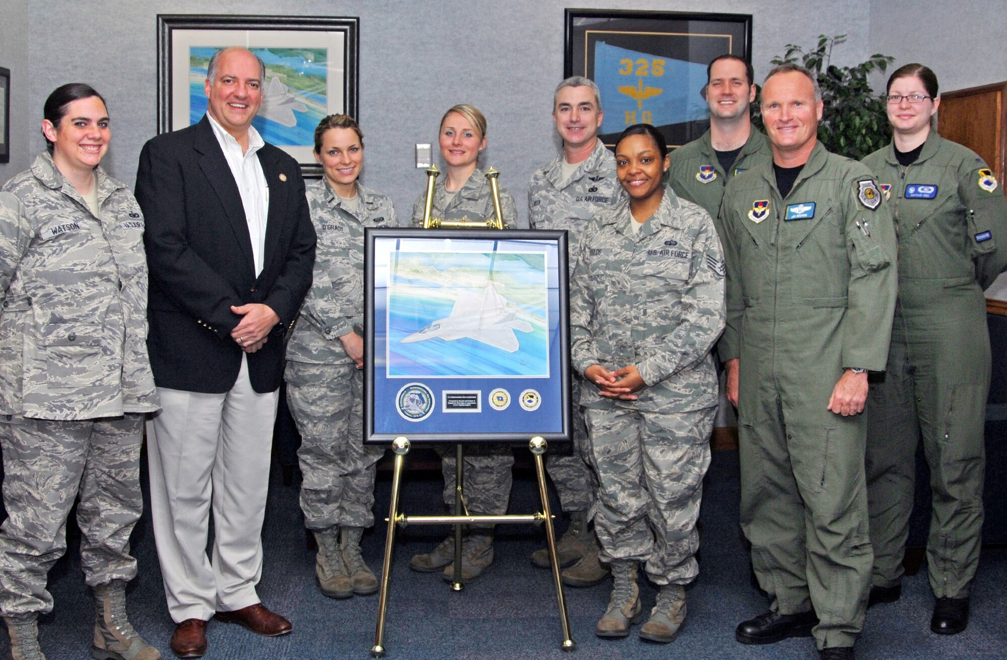 Florida’s 2nd District Representative Steve Southerland (R), was presented a framed F-22 Raptor lithograph complete with wing patch and coin during his first official visit to Tyndall Feb. 24. The presentation was made by Brig. Gen. James Browne, 325th Fighter Wing commander and members of his staff (from left to right) Staff Sgt. Maria Watson, 1st Lt. Maggie O'Grady, Tech. Sgt. Lauren Williams, Chief Master Sgt. Jackie Green, 325th FW command chief, Staff Sgt. Alechia Fields, Maj. Philip Colomy, General Browne, and 1st Lt. Caitlin Fox.  Congressman Southerland is a lifelong resident of Panama City. He grew up in the Forest Park neighborhood, attended Mowat Middle School and graduated from A. Crawford Mosley High School in 1983. Representative Southerland served as the Chairman, Bay County Chamber of Commerce Military Affairs Committee and as a 325th Fighter Wing Honorary Commander in 2008. He was elected to the U.S. House of Representatives in November 2010. (U.S. Air Force photo)
