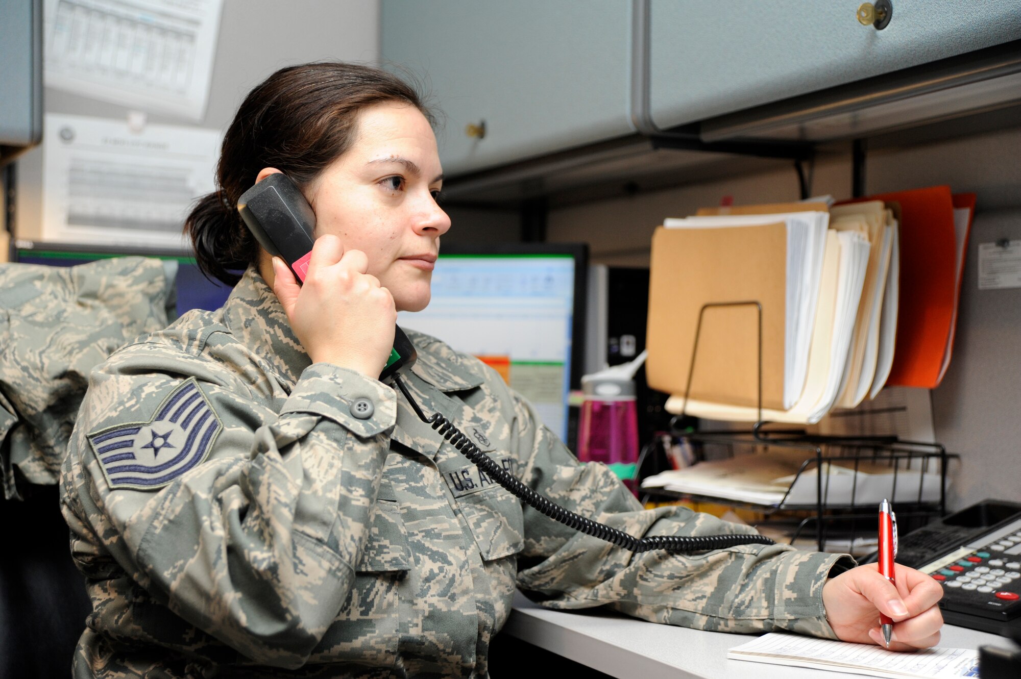 Tech. Sgt. Sonia Harrison, 22nd Medical Group Medical Readiness NCOIC, monitors the police and fire radio network for medical calls, Feb. 24, 2011, McConnell Air Force Base, Kan. The Anaheim, Calif., native also ensures the 22nd MDG deployment is ready by monitoring training, deployments, and the reintegrating of deployers. (U.S. Air Force photo/Airman 1st Class Armando A. Schwier-Morales)