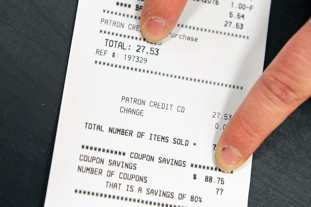 Mandy Morford, Ellsworth Coupon Cutter page administrator, points out the total and coupon savings on a Commissary receipt at Ellsworth Air Force Base, S.D., Feb. 22, 2011.  She saved $88.75 on her groceries by using 77 coupons. (U.S. Air Force photo/Staff Sgt. Marc I. Lane)