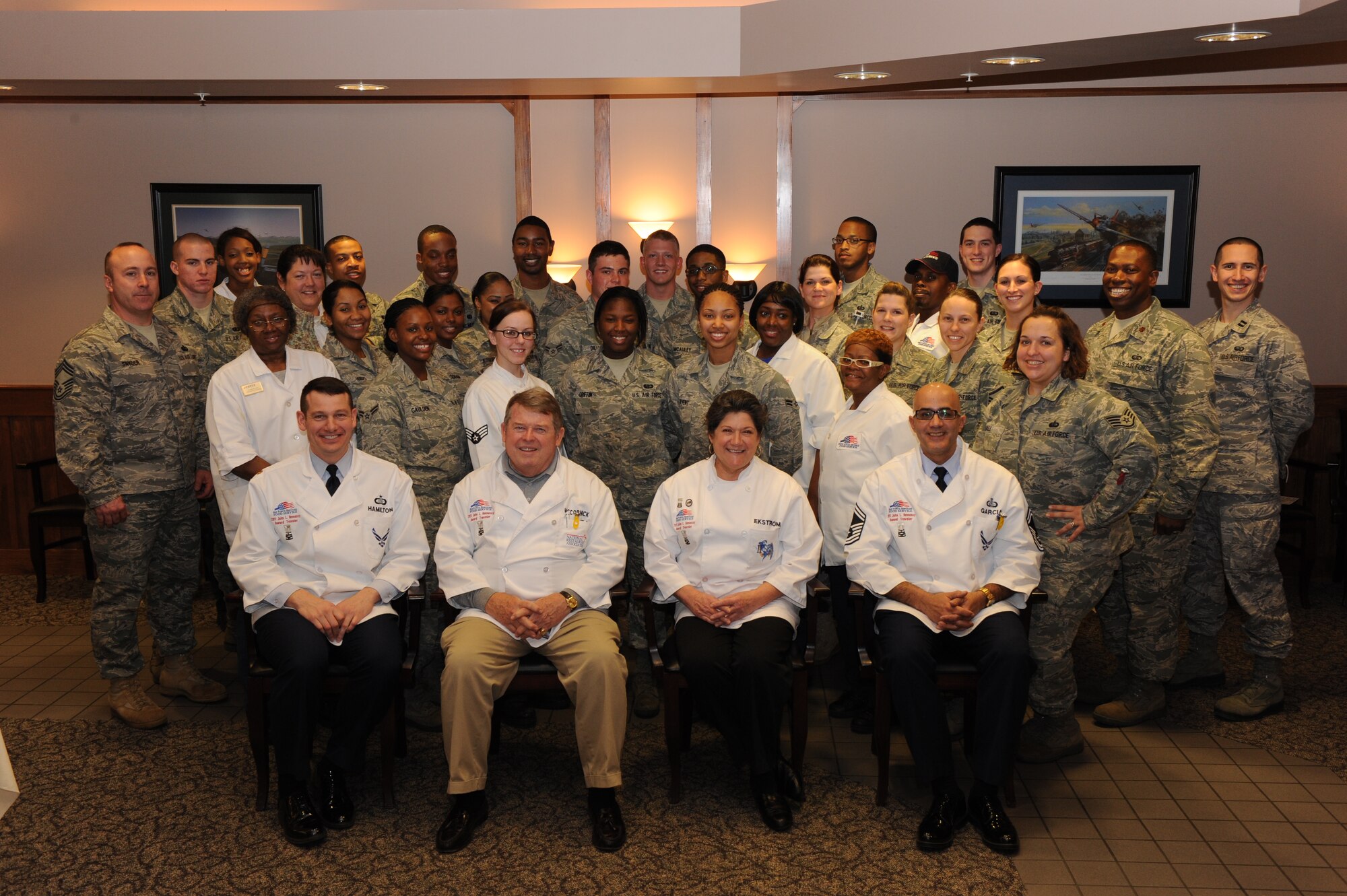 SEYMOUR JOHNSON AIR FORCE BASE, N.C. – The Hennessy Evaluation Team and Seymour Johnson Air Force Base dining facility staff members pose for a photo Feb. 11, 2011. The Hennessy Evaluation Team spent two days inspecting the staff in five different categories based on the Food Service Evaluation Record. The inspected categories include kitchen operations, serving and dining operations, sanitation and repair maintenance management, training and readiness program and management. (U.S. Air Force photo/Robin DeMark)  