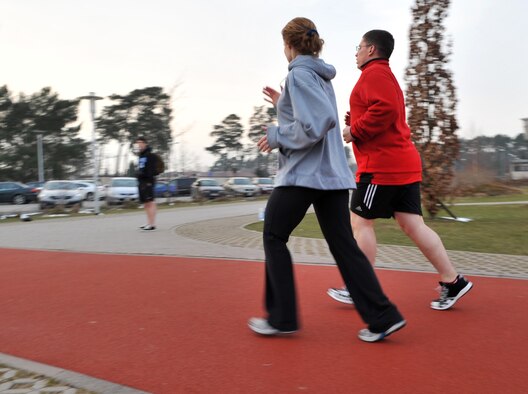 Adrianna Mitchell, certified personal trainer, assesses a runner during the Running for Dummies running clinic at the Health and Wellness Center, Ramstein Air Base, Germany, Feb. 23, 2011.  Running for Dummies is a class dedicated to helping people learn to run safely and properly.  For more information contact the Ramstein HAWC. (U.S. Air Force photo by Senior Airman Caleb Pierce)