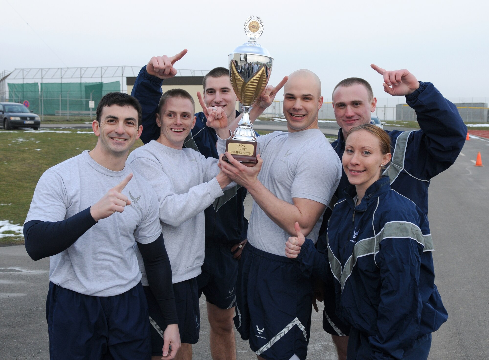 SPANGDAHLEM AIR BASE, Germany – Members of the 52nd Communications Squadron celebrate after winning the Spangdahlem Air Base Iron Flight Competition at the Combat Fitness Center here Feb. 23. The competition consisted of six-person teams from squadrons across the base and consisted of a variety of individual and team challenges. Four teams competed for the Iron Flight title. (U.S. Air Force photo/Senior Airman Nathanael Callon)