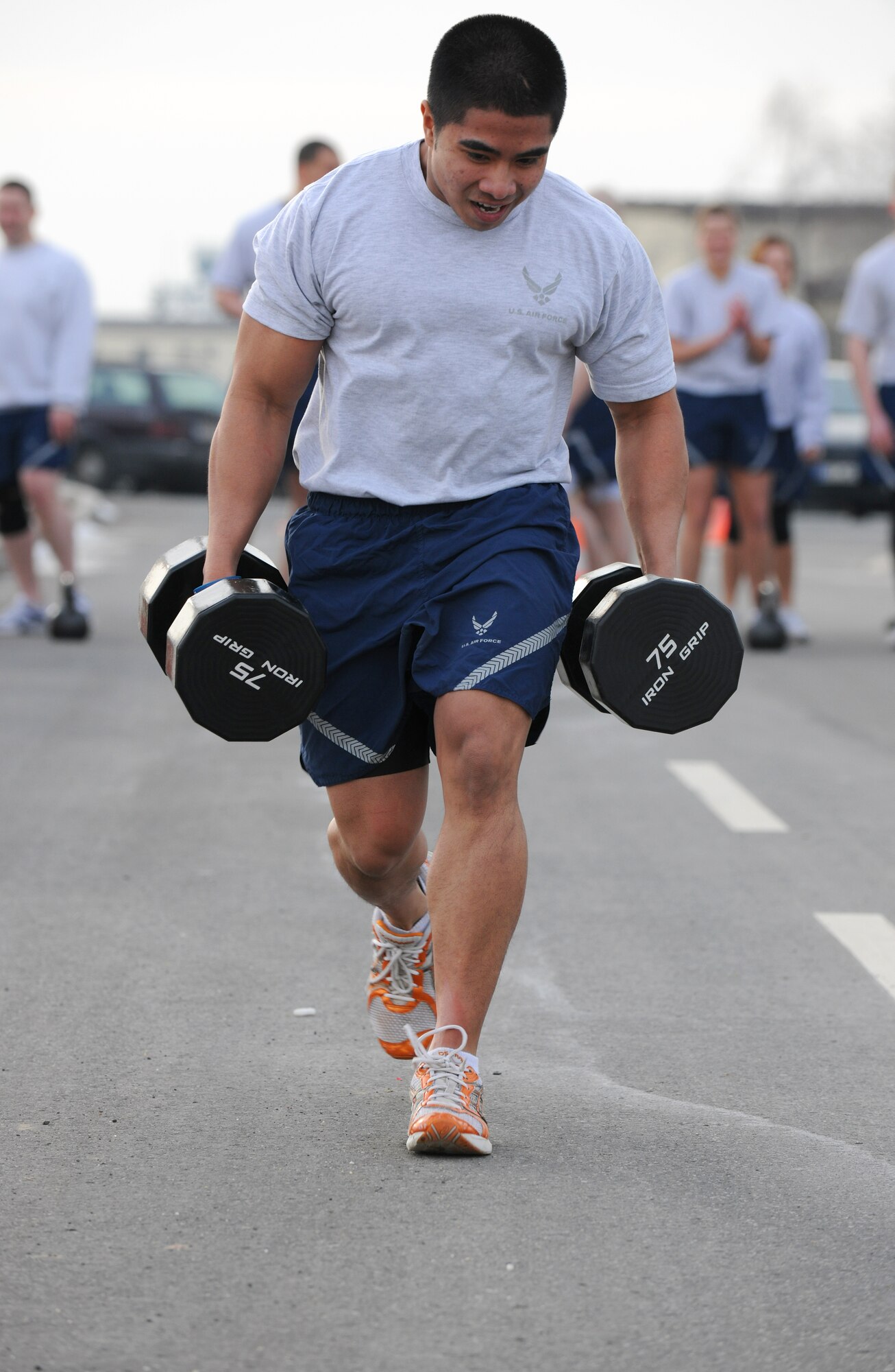 SPANGDAHLEM AIR BASE, Germany – Airman 1st Class Urzus Gange, 52nd Logistics Readiness Squadron, runs with weights during the Spangdahlem Air Base Iron Flight Competition at the Combat Fitness Center here Feb. 23. The competition consisted of six-person teams from squadrons across the base and consisted of a variety of individual and team challenges. The 52nd Communications Squadron won the competition out of the four teams that competed. (U.S. Air Force photo/Senior Airman Nathanael Callon)