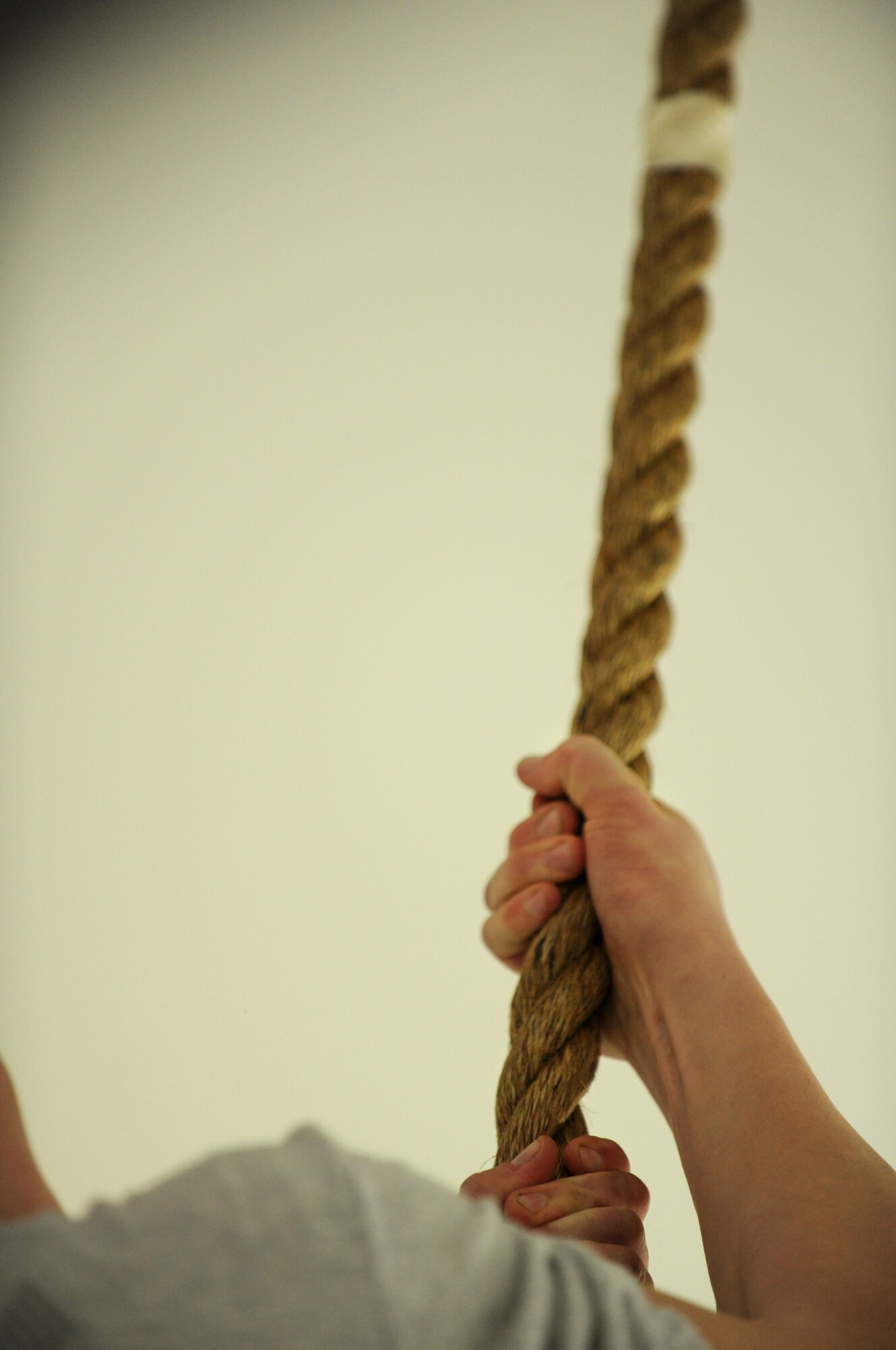 SPANGDAHLEM AIR BASE, Germany – An Airman from the 52nd Fighter Wing climbs a rope during the Spangdahlem Air Base Iron Flight Competition at the Combat Fitness Center here Feb. 23. The competition consisted of six-person teams from squadrons across the base and consisted of a variety of individual and team challenges. The 52nd Communications Squadron won the competition out of the four teams that competed. (U.S. Air Force photo/Senior Airman Nathanael Callon)