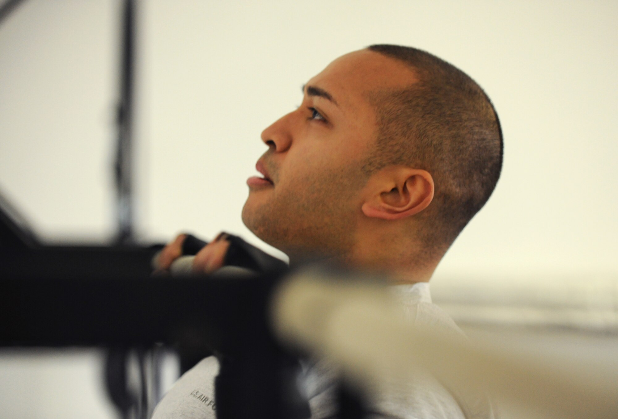 SPANGDAHLEM AIR BASE, Germany – Airman 1st Class Jason Sugimoto, 52nd Force Support Squadron, takes a rest while doing pull-ups during the Spangdahlem Air Base Iron Flight Competition at the Combat Fitness Center here Feb. 23. The competition consisted of six-person teams from squadrons across the base and consisted of a variety of individual and team challenges. The 52nd Communications Squadron won the competition out of the four teams that competed. (U.S. Air Force photo/Senior Airman Nathanael Callon)