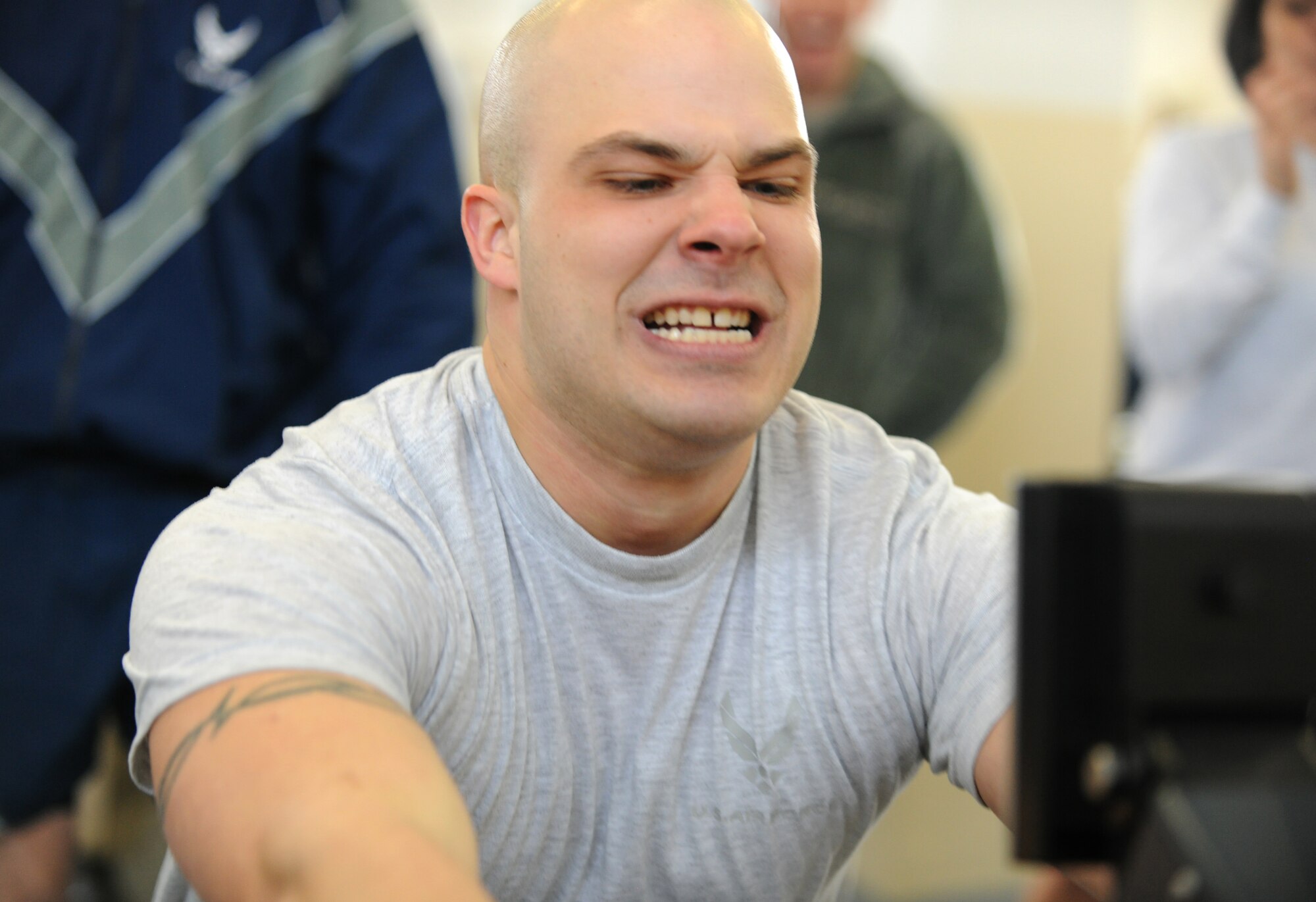 SPANGDAHLEM AIR BASE, Germany – Senior Airman Christopher Chesnek, 52nd Communications Squadron, rows on a rowing machine during the Spangdahlem Air Base Iron Flight Competition at the Combat Fitness Center here Feb. 23. The competition consisted of six-person teams from squadrons across the base and consisted of a variety of individual and team challenges. The 52nd Communications Squadron won the competition out of the four teams that competed. (U.S. Air Force photo/Senior Airman Nathanael Callon)