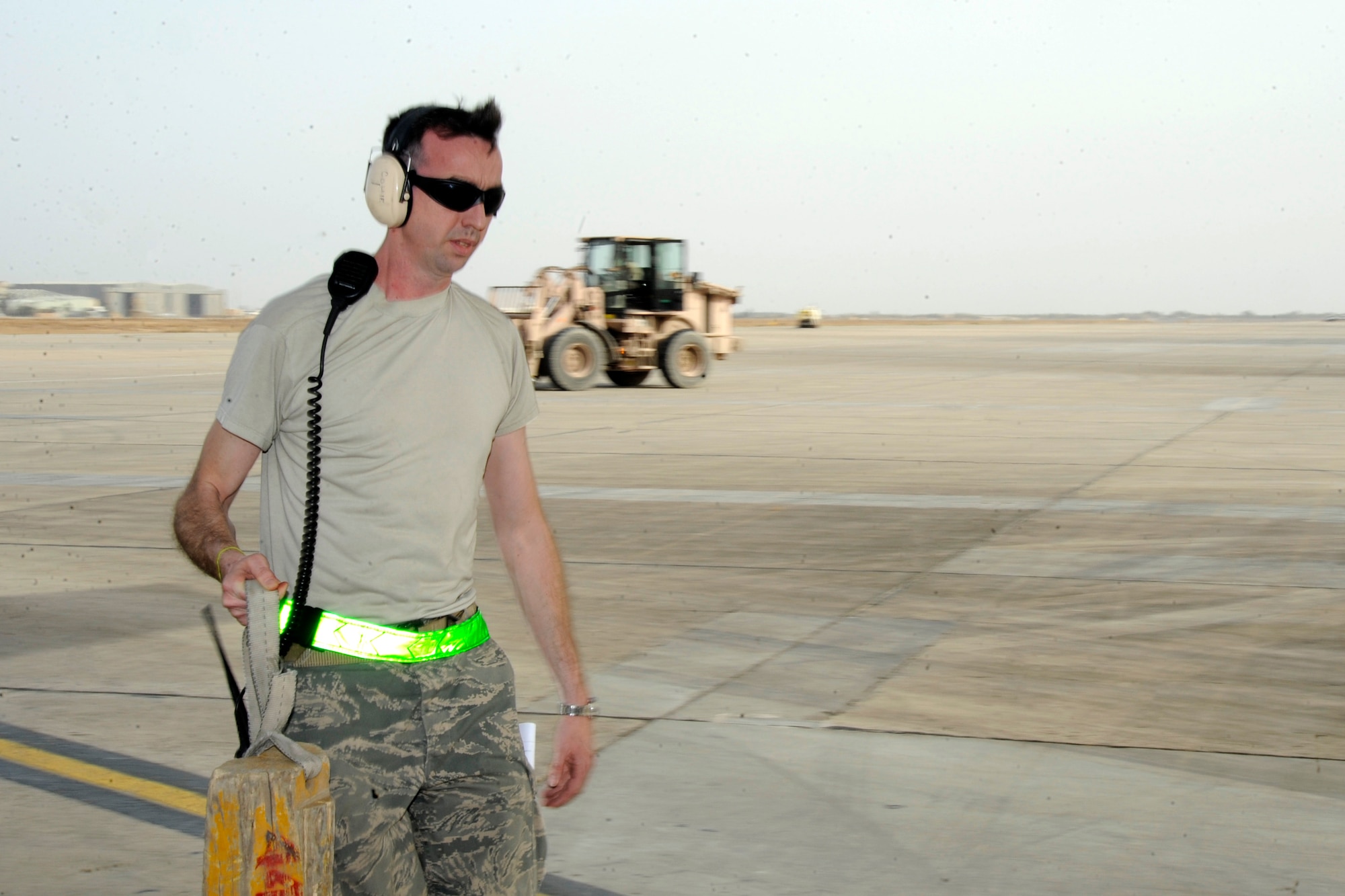 BAGHDAD -- Tech. Sgt. Jerry McPherson, 447th Expeditionary Logistics Readiness Squadron Air Tactical Operations Center controller, prepares to upload cargo into an aircraft on the flightline at Sather Air Base Feb. 24. The 447th Air Expeditionary Group operates the busiest aerial port within the Iraq area of operations.  The airfield handles nearly 80 movements of rotary and fixed-wing aircraft daily and more than 9,000 movements in the last six months. (U.S. Air Force photo by Tech. Sgt. Randy Redman)