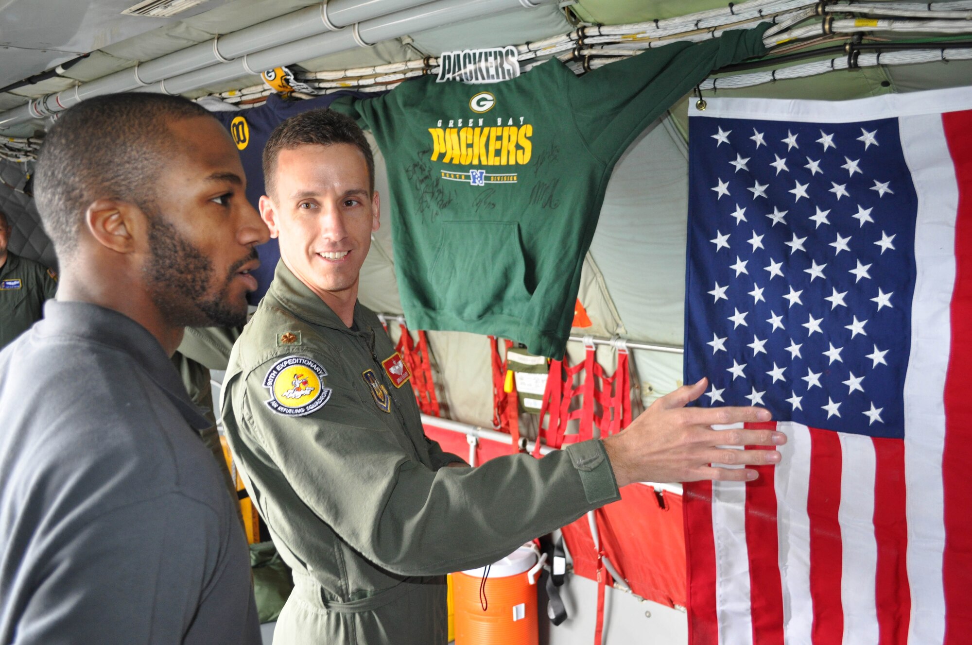 Jarrett Bush, a cornerback from the National Football League team the Green Bay Packers, meets Maj. Brian Weaver, from the 385th Air Expeditionary Group, during a visit to Incirlik Air Base, Turkey, Feb. 12, 2011. The trip was organized by Navy Entertainment and the 39th Force Support Squadron as part of the team’s “Tundra Tour.” Super Bowl XLV champions Jarrett Bush, Derrick Martin, William Henderson, Frank Zombo, Nick McDonald, and Daryn Colledge, as well as Pepper Burruss, the head athletic trainer for the Packers, conducted a behind-the-scenes presentation and an autograph session during their visit to the base.   (U.S. Air Force photo by Senior Airman John Archiquette)