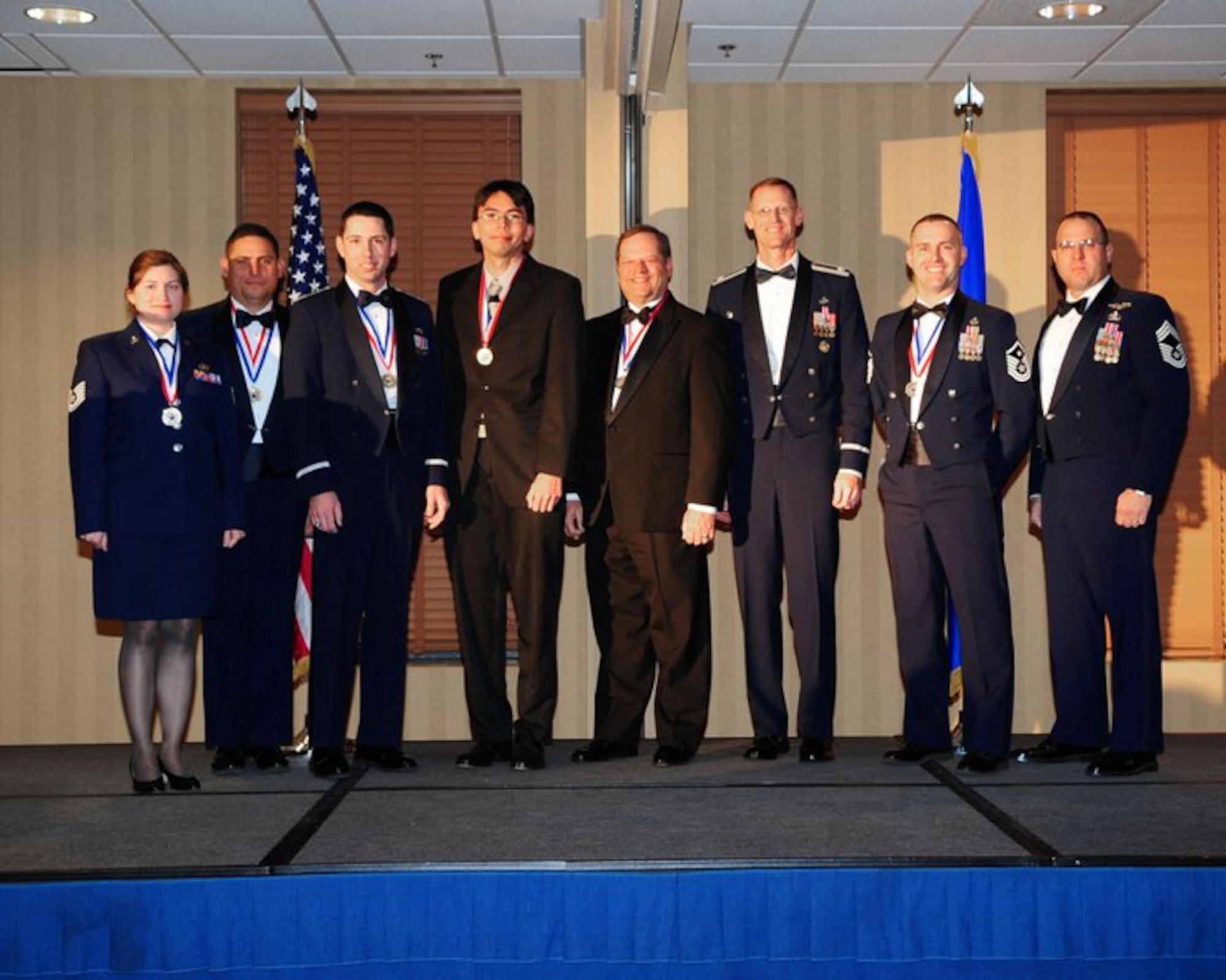 DAVIS-MONTHAN AIR FORCE BASE, Ariz. -- From left to right, Tech. Sgt. Amber Tarver, Senior Master Sgt. GabrielLacayo, Capt. Robert Davenport, Stephen Bieda, Harry Walker, Lt. Col. Lee Byerle, Master Sgt. Joseph Shelton, and Chief Master Sgt. Bradley Wasson.