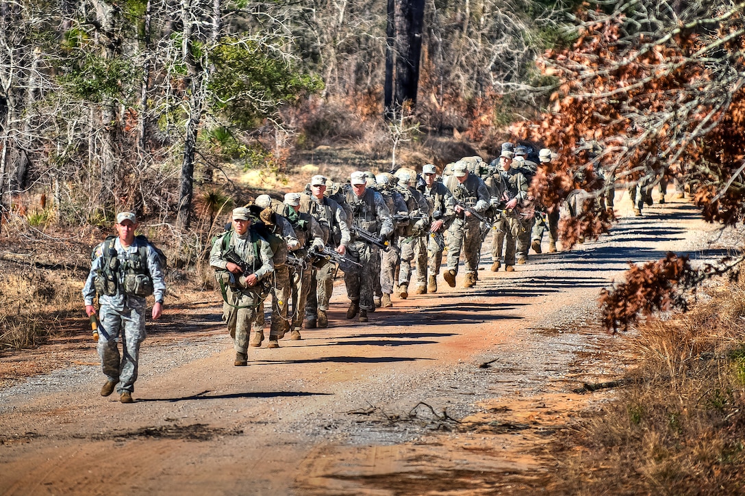 U.S. Army Ranger students march to the assembly area to receive a briefing on rope bridge, small boat and swamp training at Camp Rudder on Eglin Air Force Base, Fla., Feb. 15, 2011.