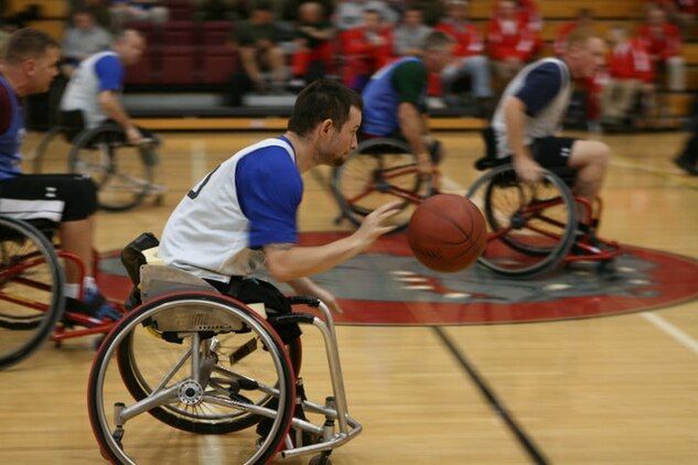 MARINE CORPS BASE CAMP PENDLETON, Calif. (Feb. 24) – Retired Cpl. Travis Greene lines up a shot during a basketball game at the Marine Corps Trials here. Photo by Aquita Brown