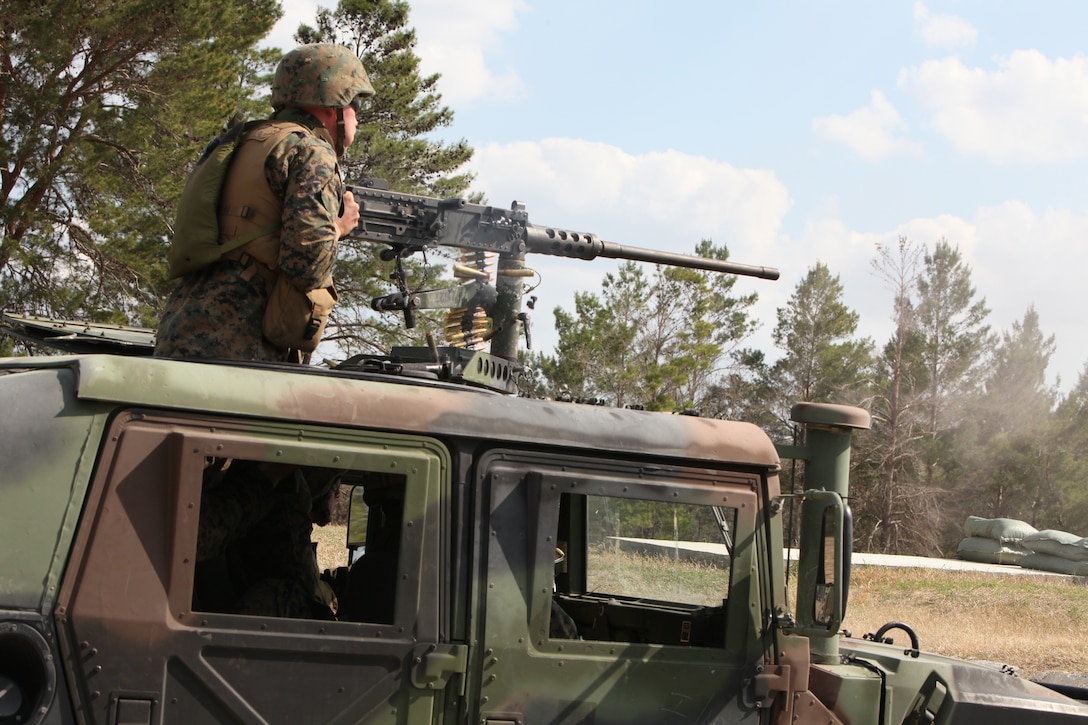 One of the qualifying crews of Scout Platoon, 4th Tank Battalion, Headquarters and Service Company, Detachment 4, engages targets with the .50 caliber machine gun of qualifications at Camp Blanding, Fla. Feb. 26.