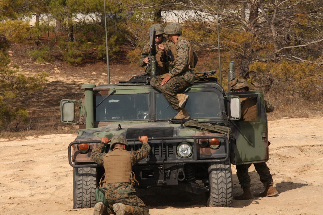 A crew from Scout Platoon 4th Tank Battalion, Headquarters and Service Company, Detachment, 4 make final preparations before taking their position on the firing line at Camp Blanding, Fla. Feb. 26.