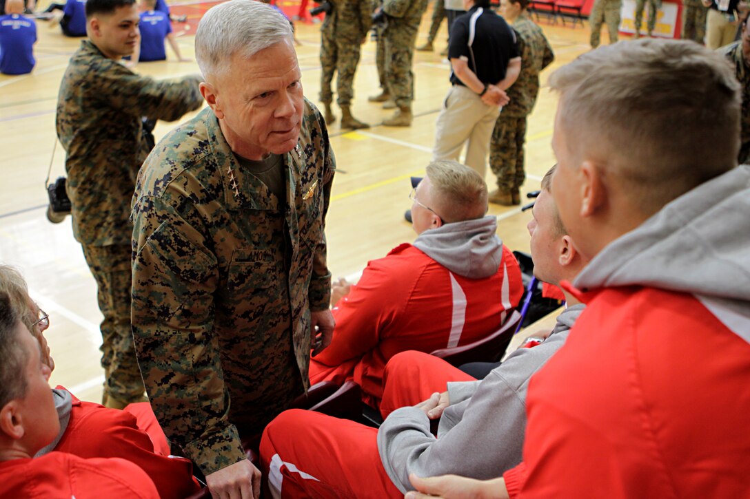 Gen. James F. Amos, 35th Commandant of the Marine Corps, speaks to injured Marines competing in the 2011 Marine Corps Trials at Camp Pendleton's Paige Field House, Feb. 25. Amos paid a visit in an effort to boost the morale of those competing. The trials are intended to select the top 50 Marine athletes to compete in the games as the All-Marine team for the Paralympics-style competition slated for May 2011. Marines competed along with allied forces and retirees in different sports including swimming, wheelchair basketball and sitting volleyball.