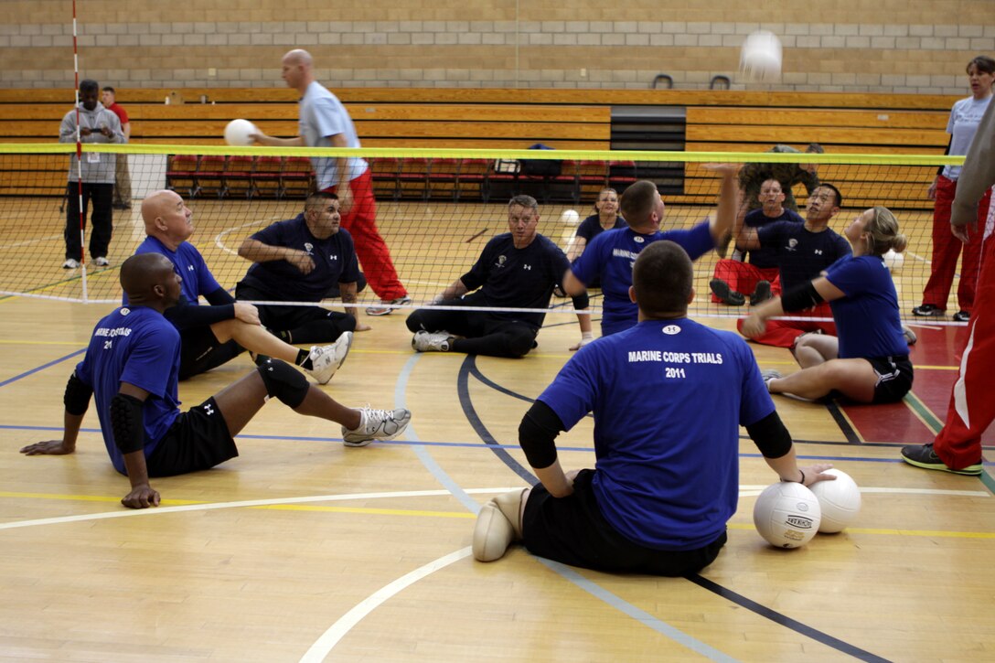 Injured Veteran Marines practice for the sitting volleyball portion of the 2011 Marine Corps Trials at Camp Pendleton’s Paige Field House, Feb. 25. The trials are intended to select the top 50 Marine athletes to compete in the Wounded Warrior Games as the All-Marine team for the Paralympics-style competition slated for May 2011.