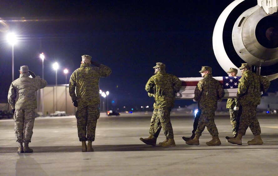 A U.S. Marine Corps carry team transfers the remains of Marine Cpl. Jonathan W. Taylor, of Homosassa, Fla., at Dover Air Force Base, Del., Feb. 25, 2011. Taylor was assigned to the 2nd Battalion, 8th Marine Regiment, 2nd Marine Division, II Marine Expeditionary Force, Camp Lejeune, N.C. (U.S. Air Force photo/Roland Balik)
