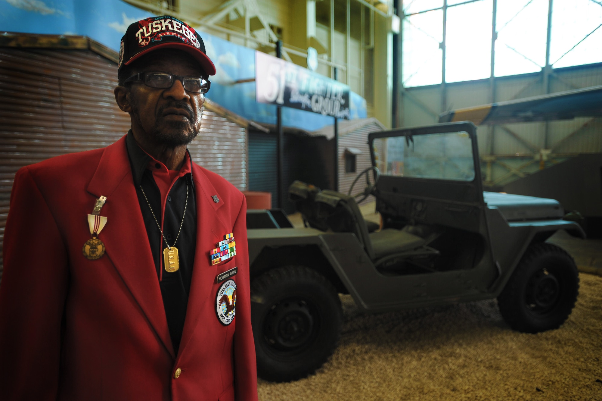 Retired Air Force Tech. Sgt Norman Artis visits the Pacific Aviation Museum on Ford Island, Hawaii Feb. 11. Mr. Artis served during the Korean War, Cold War and Vietnam War as a supply and maintenance troop. (U.S. Air Force photo/Airman 1st Class Lauren Main)