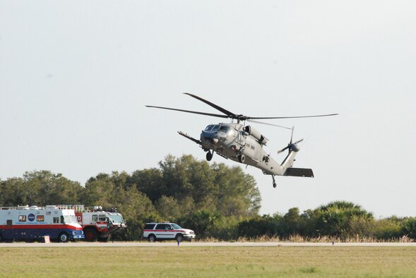 KENNEDY SPACE CENTER, Fla.  - Airmen from the 920th Rescue Wing at nearby Patrick Air Force Base land this HH-60G Pave Hawk helicopter at the shuttle landing facility here in preparation for Space Shuttle Discovery's last lift off Feb. 24. The Reserve Airmen provide NASA space shuttle support operations and are responsible for rescuing the astronauts if they were to bail out of the shuttle into the Ocean due to an emergency situation. Not only are the reservists on alert during lift off, but remain ready for anything until the shuttle returns safely with the astronauts on board. (U.S. Air Force photo/Capt. Matthew C. Simpson)