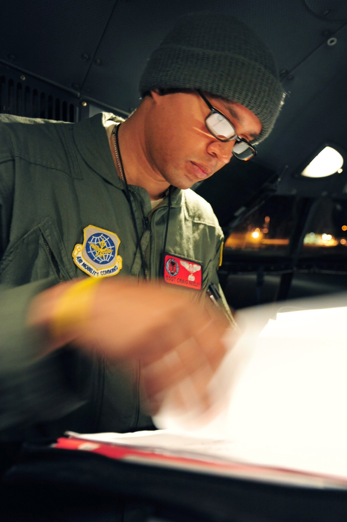 Staff Sgt. Craig Neeley monitors the flight systems on a C-130H Hercules during a Joint Operational Access Exercise Feb. 14, 2011, at Pope Air Force Base, N.C. The exercise trains Soldiers and Airmen to deploy at a moment's notice and sustain the mission anywhere in the world. Sergeant Neeley is a 50th Airlift Squadron flight engineer. (U.S. Air Force photo/Senior Airman Jim Araos)