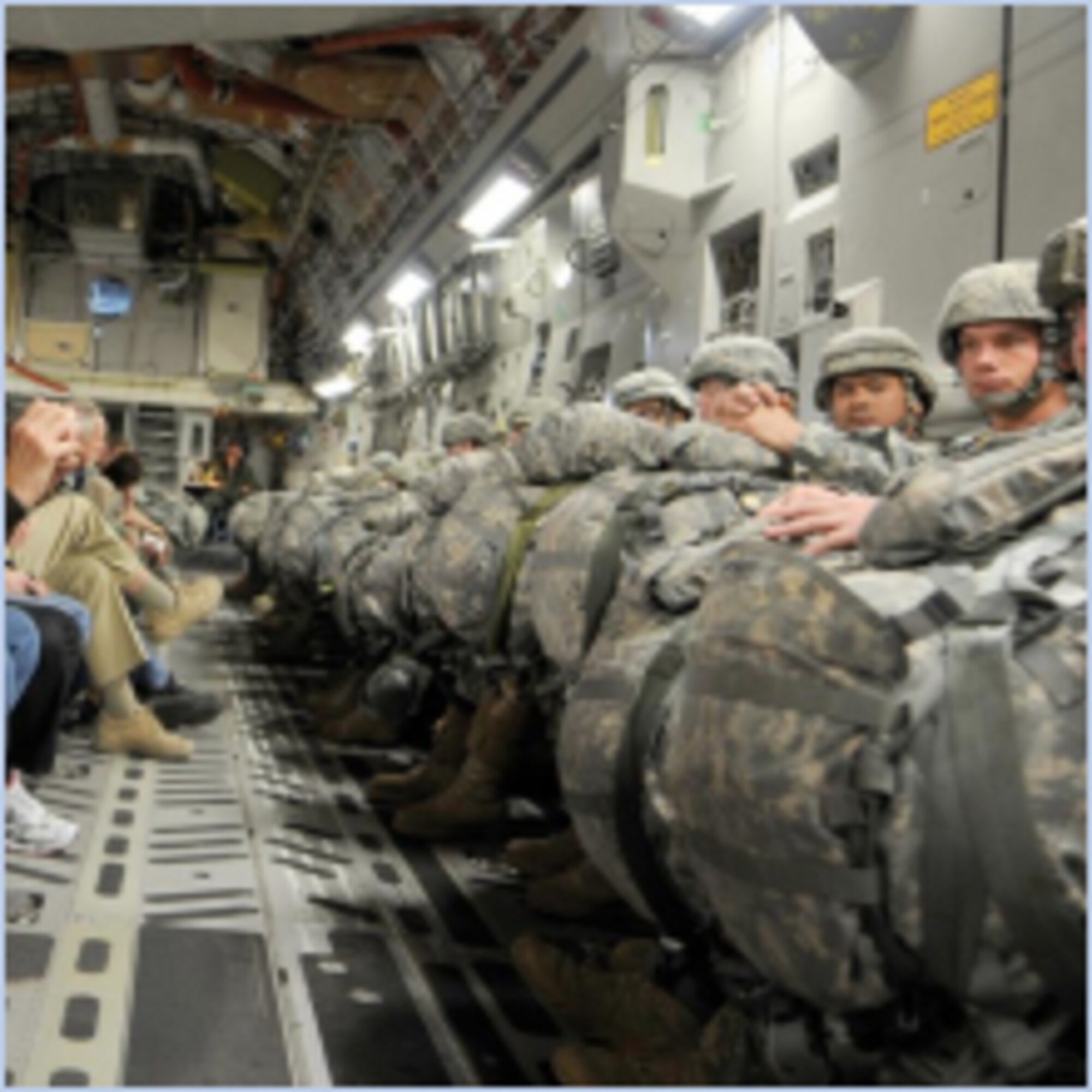 Vickie McCall, a member of the Air Force Chief of Staff Civic Leader Program, is shown talking with paratroopers from U.S. Army Alaska stationed at Joint Base Elmendorf-Richardson on board an Air Force C-17 prior to their jump, in this photo taken Aug. 11, 2010.  (U.S. Air Force photo by Andy Morataya)