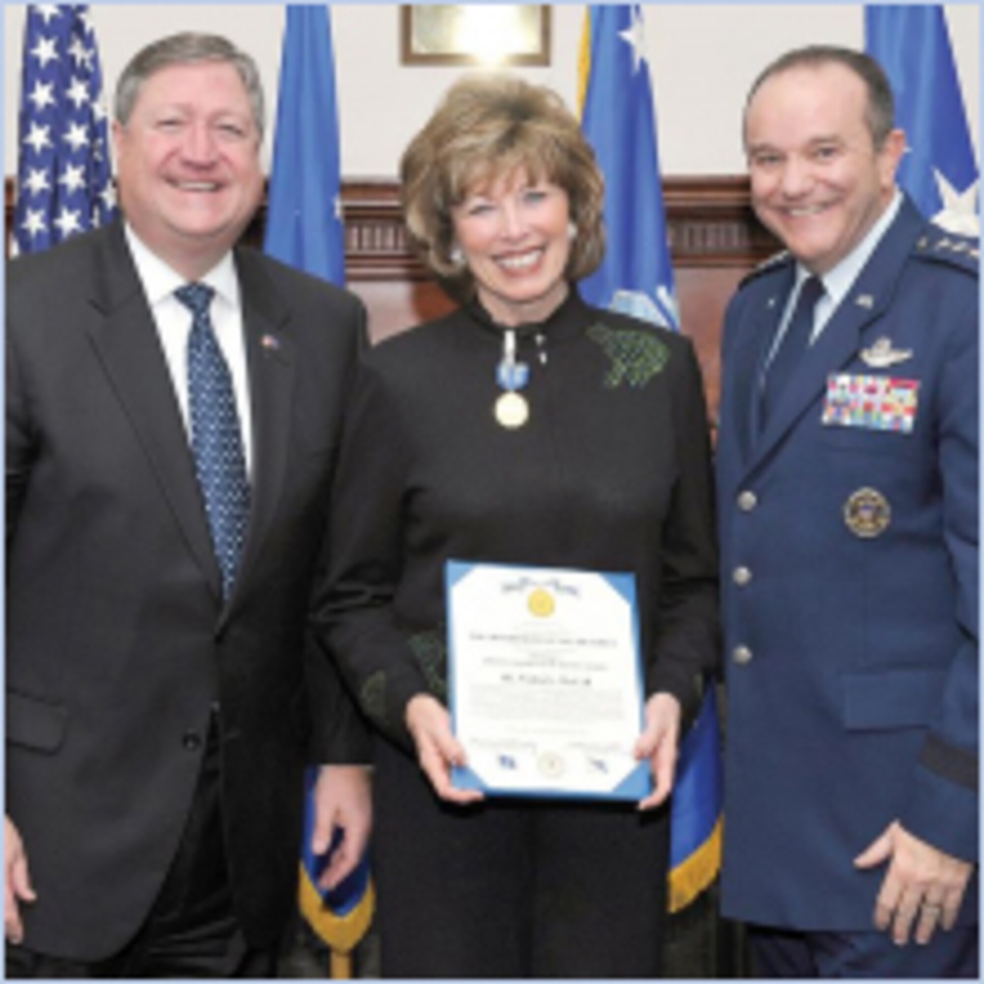 Michael Donley, Secretary of the Air Force, and Gen. Phillip Breedlove, Air Force Vice Chief of Staff, present the Air Force Distinguished Public Service Award to Vickie McCall during a dinner in honor of the Air Force Chief of Staff Civic Leaders on Feb. 2 at Joint Base Anacostia-Bolling. (U.S. Air Force photo by Michael J. Pausic)