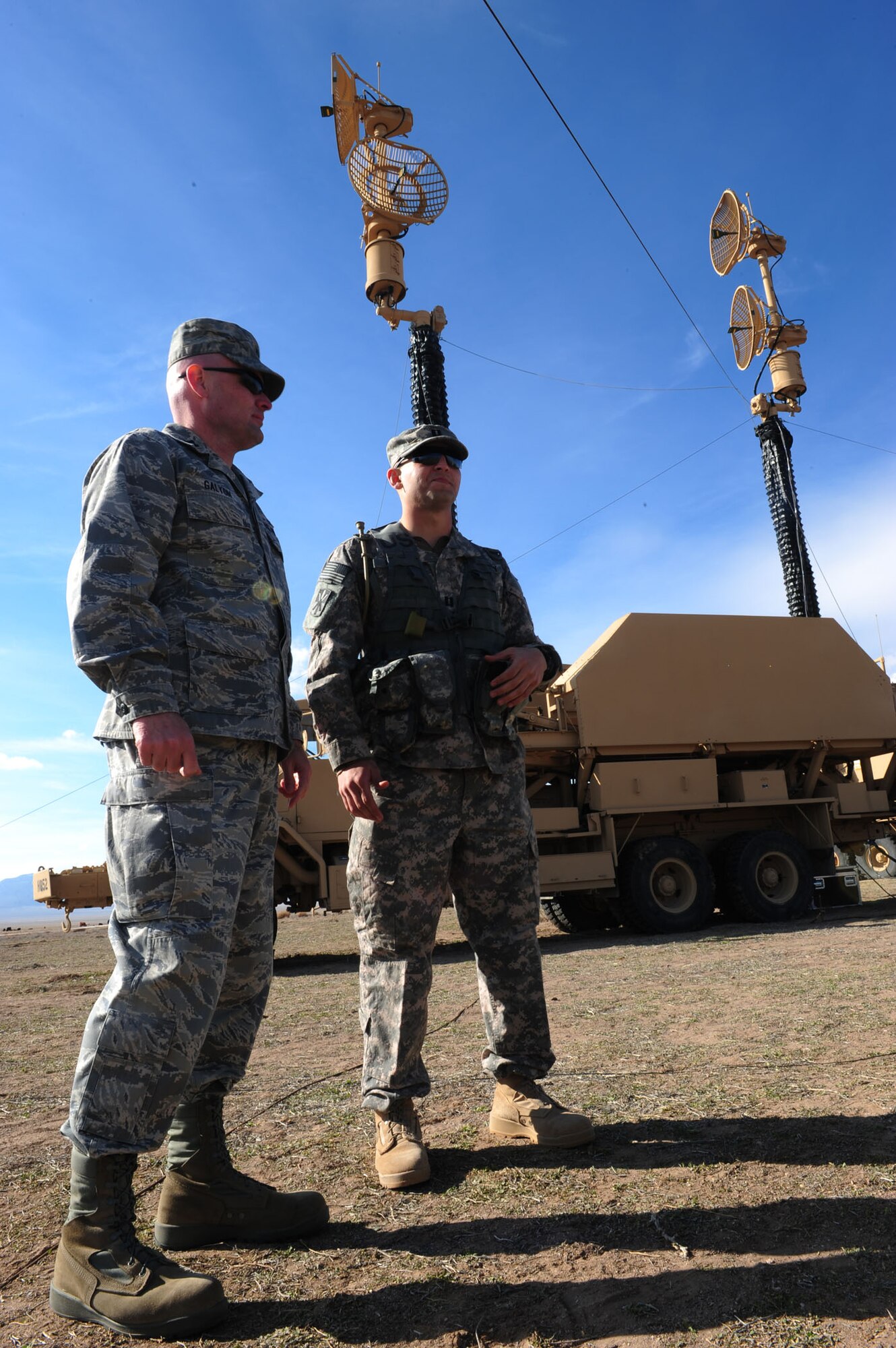 CALIENTE, Nev. -- U.S. Air Force Capt. James Galyon, 99th Air Base Wing chaplain, discusses troop morale and welfare with U.S. Army Capt. Matthew Perez, 1-7 Air Defense Artillery Battalion Delta Battery commander, during Operation Red Flag 11-3 Feb. 24. The battalion's mission is to provide air defense for friendly forces and allies to allow freedom of maneuver. Red Flag is a realistic combat training exercise that provides heavily-contested and degraded operational environments to prepare crews for major combat operations against a near-peer adversary. (U.S. Air Force photo by 2nd Lt. Tony Richardson) (Released)