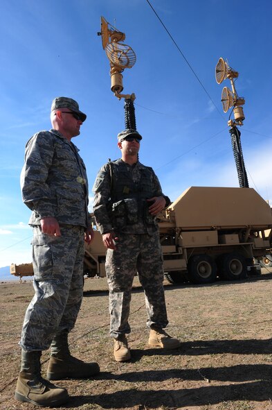 CALIENTE, Nev. -- U.S. Air Force Capt. James Galyon, 99th Air Base Wing chaplain, discusses troop morale and welfare with U.S. Army Capt. Matthew Perez, 1-7 Air Defense Artillery Battalion Delta Battery commander, during Operation Red Flag 11-3 Feb. 24. The battalion's mission is to provide air defense for friendly forces and allies to allow freedom of maneuver. Red Flag is a realistic combat training exercise that provides heavily-contested and degraded operational environments to prepare crews for major combat operations against a near-peer adversary. (U.S. Air Force photo by 2nd Lt. Tony Richardson) (Released)