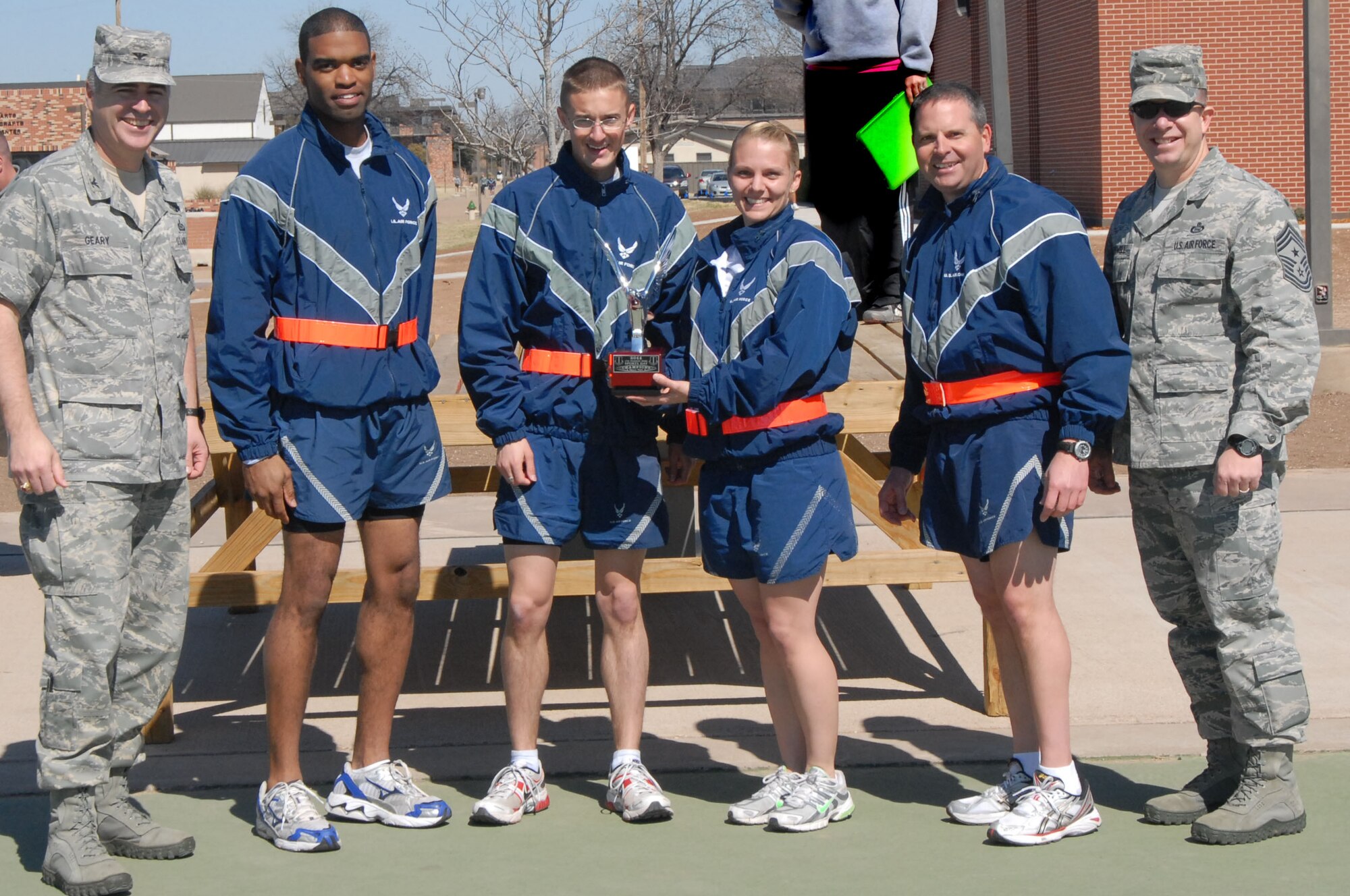 GOODFELLOW AIR FORCE BASE, Texas-- Col. Thomas Geary, 17th Training Wing Commander and  Chief Master Sgt. Brendan Criswell, 17th TRW Command Chief, present Lt. Col. Michael LePage, 17th Training Support Squadron Commander, and his team with the Quarterly Sports Day Small Unit Award, Feb. 25. (U.S. Air Force photo/Airman 1st Class Jessica Keith)