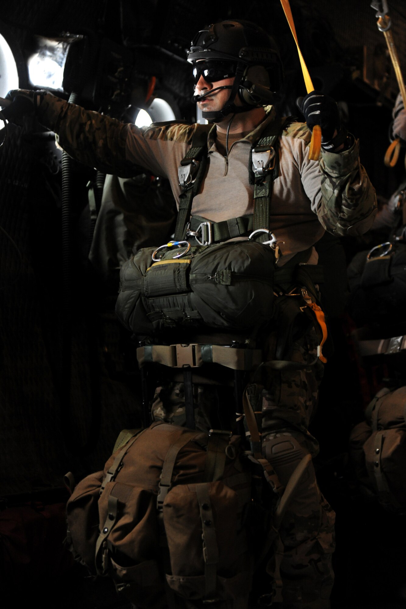 VALDOSTA, Ga. -- Staff Sgt. Paul Merck, 38th Rescue Squadron survival, evasion, resistance and escape specialist, prepares for a static line jump at the Valdosta Regional Airport Feb. 24. Sergeant Merck jumped last after ensuring all other jumpers exited the aircraft safely into the drop zone.(U.S. Air Force photo/Airman 1st Class Benjamin Wiseman)(RELEASED)