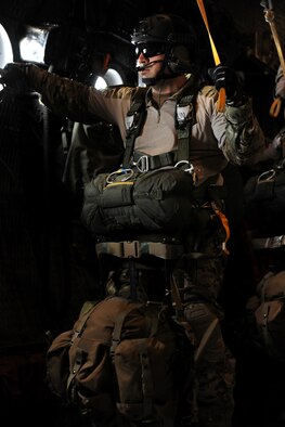 VALDOSTA, Ga. -- Staff Sgt. Paul Merck, 38th Rescue Squadron survival, evasion, resistance and escape specialist, prepares for a static line jump at the Valdosta Regional Airport Feb. 24. Sergeant Merck jumped last after ensuring all other jumpers exited the aircraft safely into the drop zone.(U.S. Air Force photo/Airman 1st Class Benjamin Wiseman)(RELEASED)