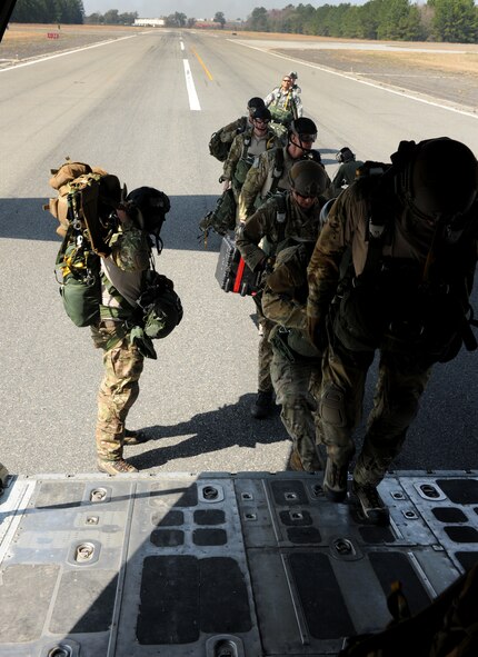 VALDOSTA, Ga. -- Members of the 347th Rescue Group and 820th Base Defense Group load a waiting HC-130P Combat King aircraft at the Valdosta Regional Airport Feb. 24. The aircraft made three passes by the drop zone to unload the 12 jumpers into the designated area. (U.S. Air Force photo/Airman 1st Class Benjamin Wiseman)(RELEASED)
