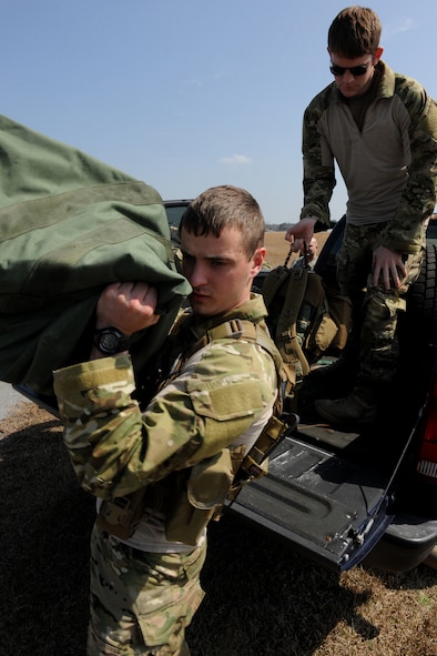 VALDOSTA, Ga. -- Senior Airman Taras Ivaniuk, 38th Rescue Squadron pararescueman, unloads equipment before a static line jump Feb. 24. Members from the 347th Rescue Group and 820th Base Defense Group jumped at the Valdosta Regional Airport from an HC-130P Combat King Aircraft from the 71st Rescue Squadron. (U.S. Air Force photo/Airman 1st Class Benjamin Wiseman)(RELEASED)