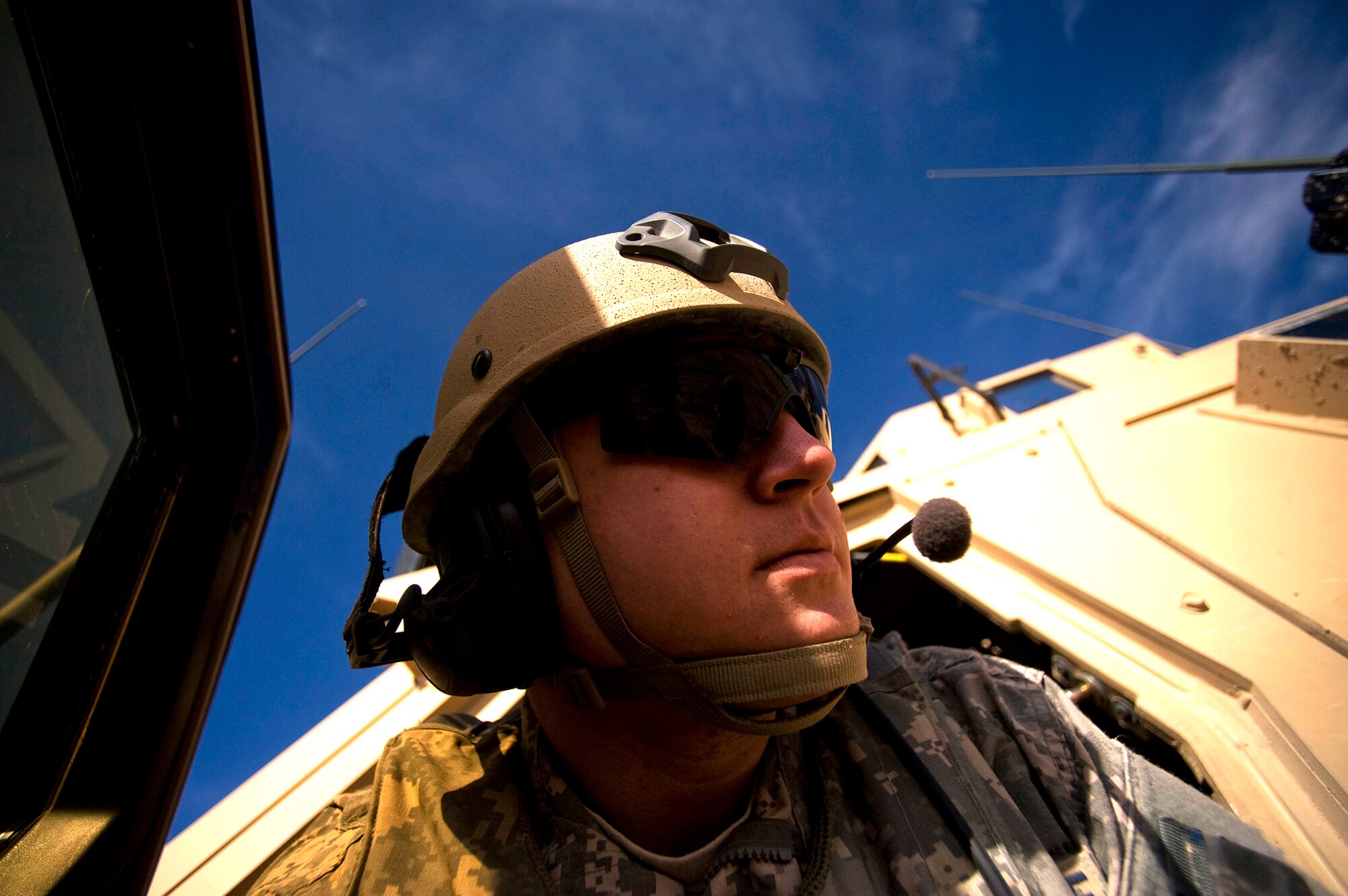 Airman 1st Class Brandon Shamhart listens to a C-130 Hercules aircrew via his radio Feb. 16, 2011, at Forward Operating Base Lagman, Afghanistan. Airman Shamhart ensured the dirt landing zone was safe for aircraft to land and depart. Airman Shamhart is a radio operator maintenance and drive assigned to the 807th Expeditionary Air Support Operations Squadron. (U.S. Air Force photo/Master Sgt. Adrian Cadiz)