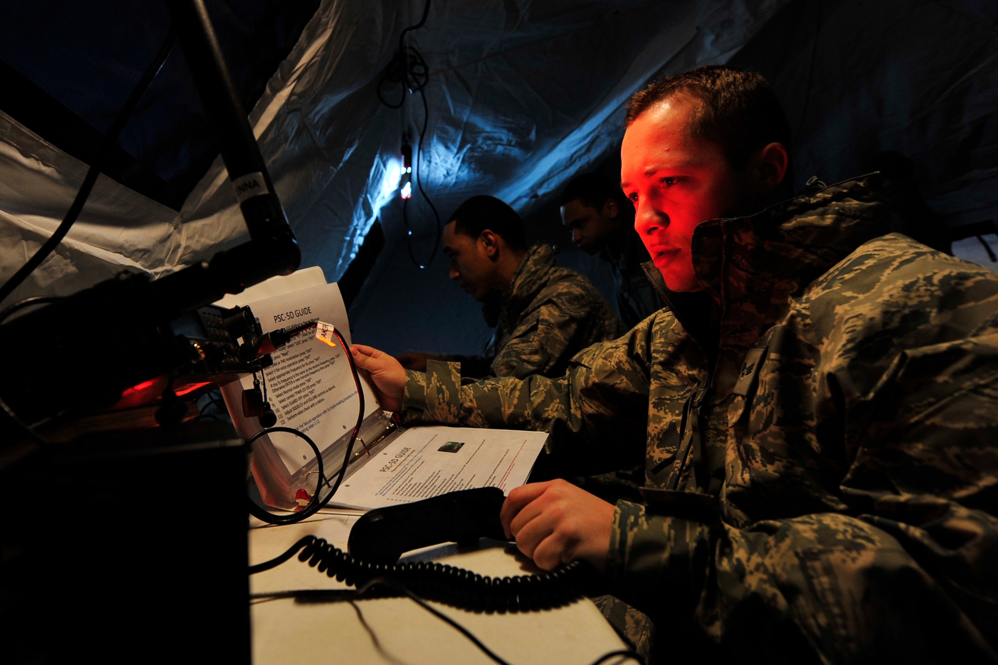JOINT BASE MCGUIRE-DIX-LAKEHURST, N.J. – Senior Airman Jesley Crider, 819th Global Support Squadron command post mission manager, sets up a AN/PSC-5D multi-band/multi-mission communications terminal during a 621st Contingency Response Element field training exercise at Lakehurst Naval Air Engineering Station Feb. 23.  As a command post technician, Airman Crider represents one of the approximately 12 career fields in a 30-man CRE.  These lightweight units are deployed worldwide, often with no-notice, to disaster areas and austere battlefield locations to assist with the movement of critical cargo.  (U.S. Air Force photo/Tech. Sgt. Parker Gyokeres/released)