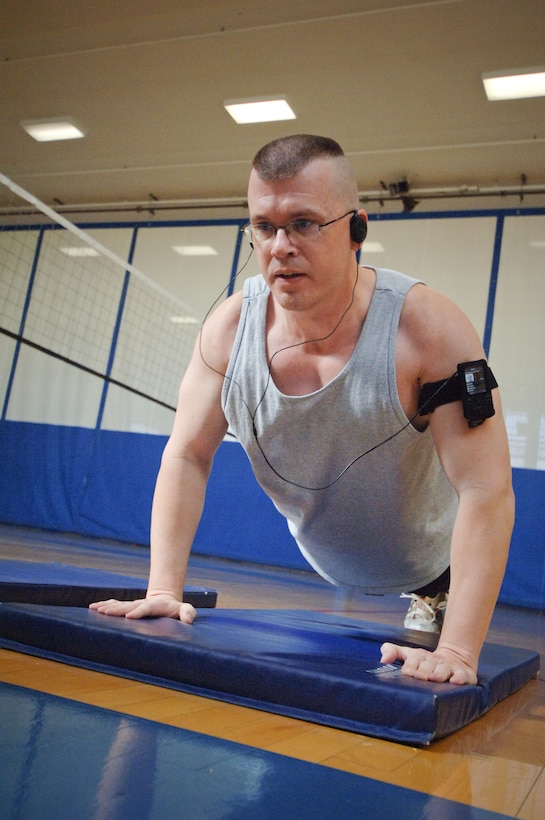 Technical Sgt. Mark Chandler exhibits enlisted spirit at the Maxwell fitness center Feb. 18 during a push-up and sit-up-athon in support of the Air Force Enlisted Heritage Hall.(Air Force photo/Melanie Rodgers Cox)