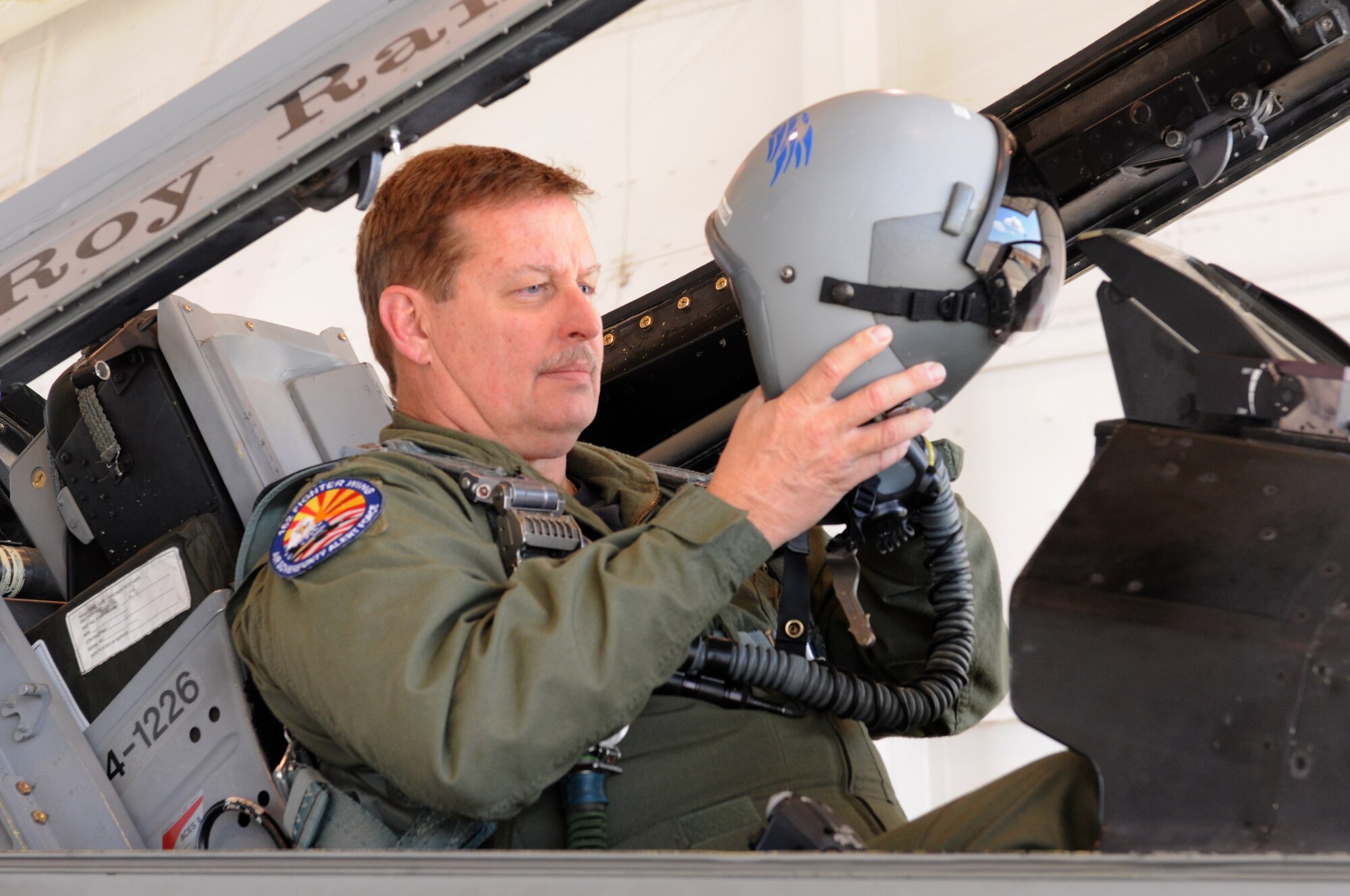 DAVIS-MONTHAN AIR FORCE BASE, Ariz.- Lt. Col. Moon Milham, commander of the 162nd Fighter Wing's Air Sovereignty Alert Detachment, gets ready for a mission at Davis-Monthan Air Force Base, Ariz. Milham, an instructor pilot by trade, had a hand in training more than 440 F-16 Fighting Falcon pilots during his career. This year, First Air Force (Air Forces Northern) named him the 2010 Air Sovereignty Alert Pilot of the Year. (U.S. Air Force photo/Maj. Gabe Johnson)