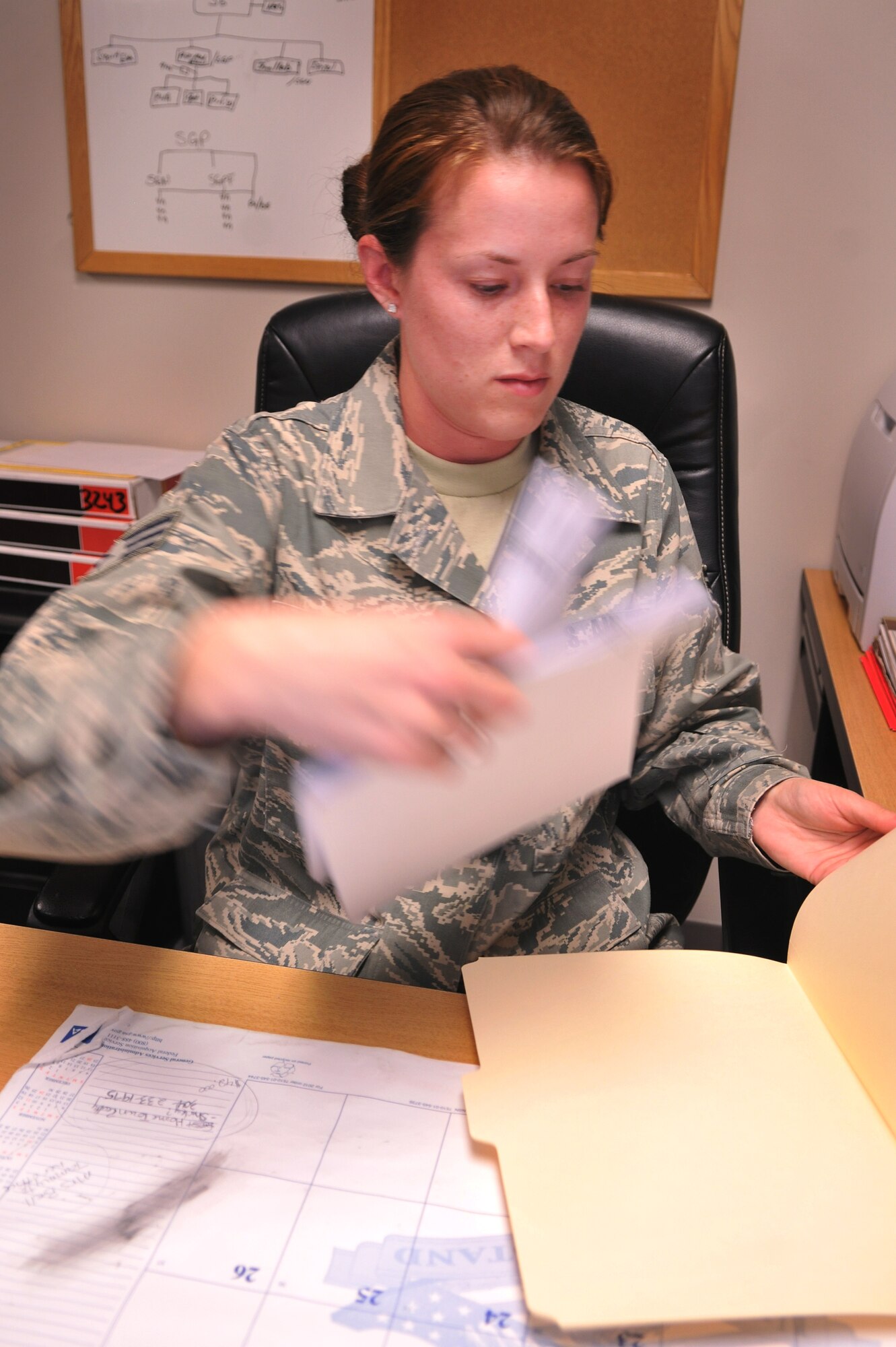 MOODY AIR FORCE BASE, Ga.-- Senior Airman Gina Simms, 476th Aerospace Medicine Flight aerospace medical service technician, sorts through folders of medical records Feb. 23. Airman Simms is a reservist who’s a part of the total force integration, which is a program that puts reservists alongside active-duty members to work hand-in-hand. (U.S. Air Force photo/Airman 1st Class Joshua Green)(RELEASED)

