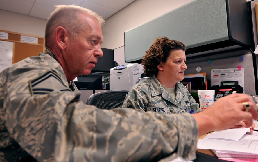 MOODY AIR FORCE BASE, Ga.-- Staff Sgt. Tamara Strange, 476th Aerospace Medicine Flight healthcare administrator, receives help on a records program from a fellow Reservist Feb 23. The 476th AMDF completes administrative duties on weekdays, but on weekend drill days, provides medical support for the other reservists. (U.S. Air Force photo/Airman 1st Class Joshua Green)(RELEASED)
