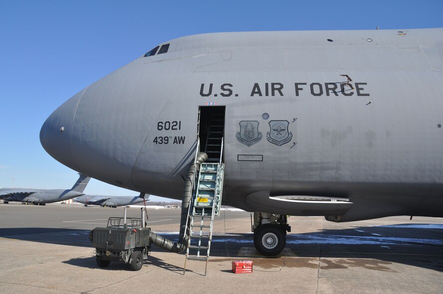 C-5B being prepared for flight parked on a Westover flightline. (US Air Force photo/Airmen 1st Class Brown)