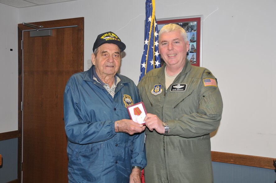 Niagara Falls native, Mr. Leo Ciskiewicz receives the Russian Jubilee Medal from Acting 914th Airlift Wing Commander Mark Murphy. Mr. Ciskiewicz, a former U.S. Navy gunners’ mate was awarded the the medal for his service during World War II (Photo by Staff Sgt. Joseph McKee)