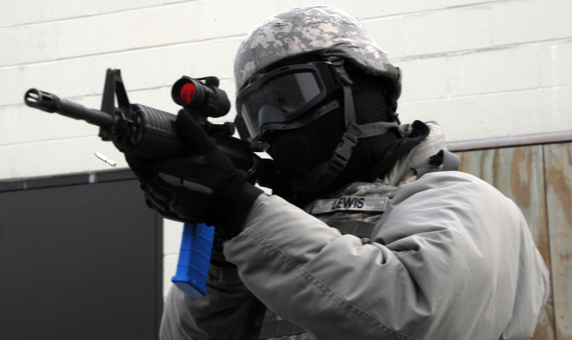 Sgt. 1st Class Brian Lewis, of the United States Army Reserve Regional Training Center-East, fires the M4 weapon using the Close Combat Training Kit manufactured by Ultimate Training Munitions, The blue magazine, bolt system and Man Marker ammunition is used to training Soldier conducting indoor or outdoor training scenarios. ((U.S. Army photo/David Moore)