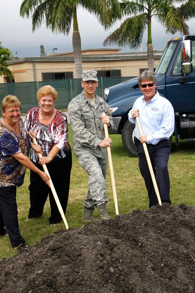 Colonel Donald Lindberg, Commander of the 482d Fighter Wing, breaks ground for new facility with Mr. Julio Martinez president of JCI Contractors and Ms. Alice Fields and Ms. Barbara Jackson with base services. The ground breaking ceremony was an exciting moment for everyone involved in implementing the new dining facility.  (Photo by Airman First Class Jacob Jimenez, 482d Fighter Wing Public Affairs)